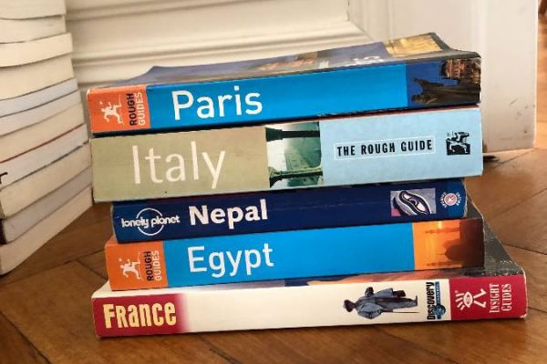Collection of English-language travel guides in good condition.